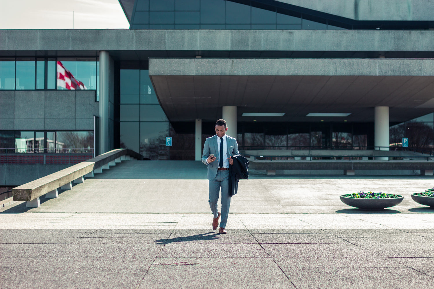 An image of a C-Suite executive walking out of a conference