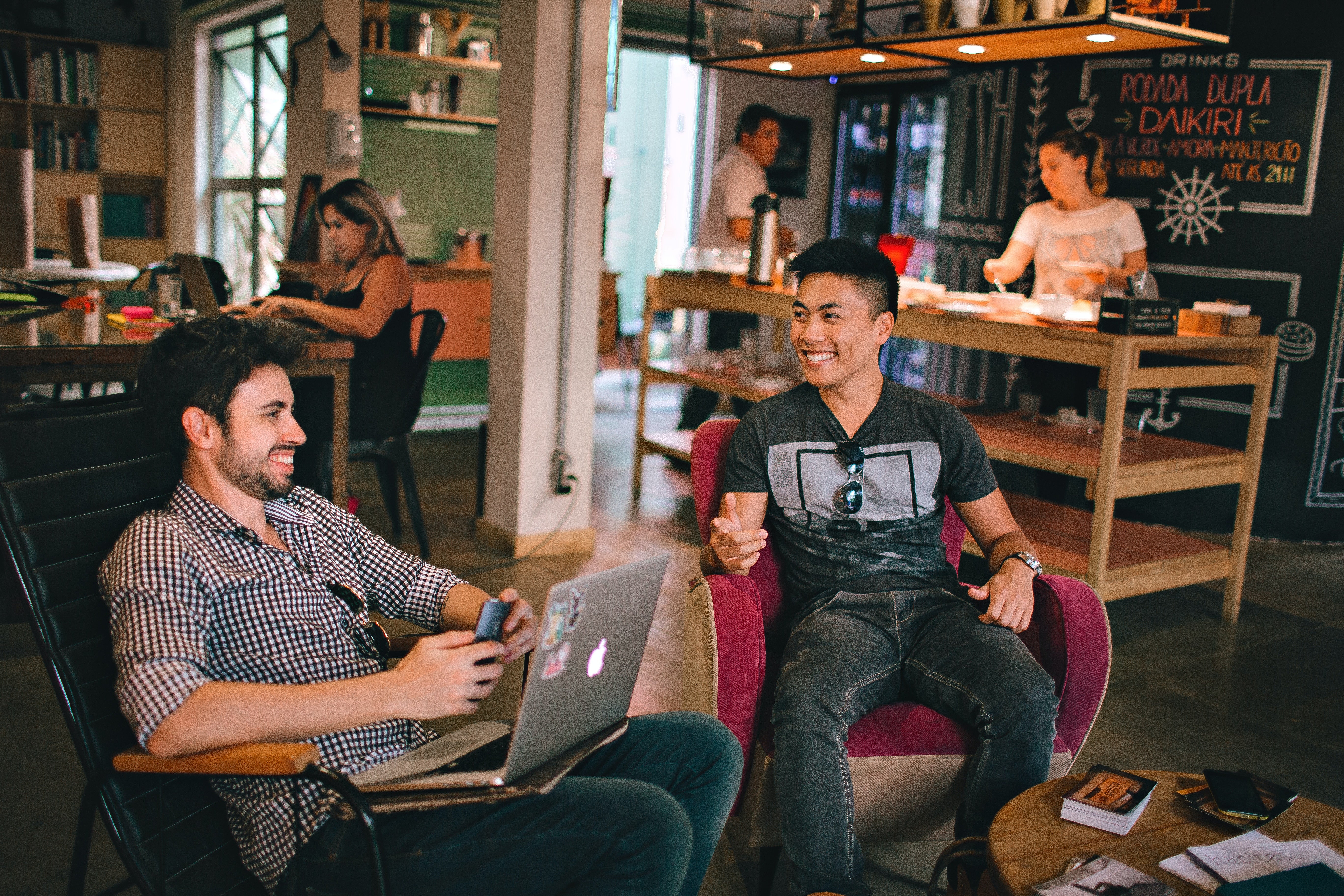 two sales executives in an office chatting