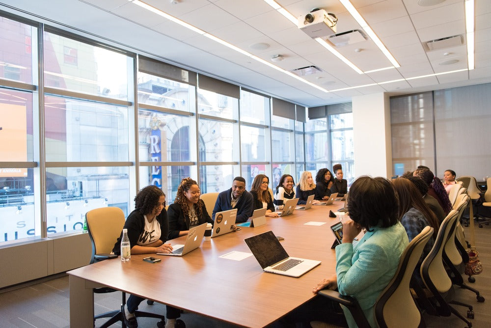 employees in a boardroom meeting